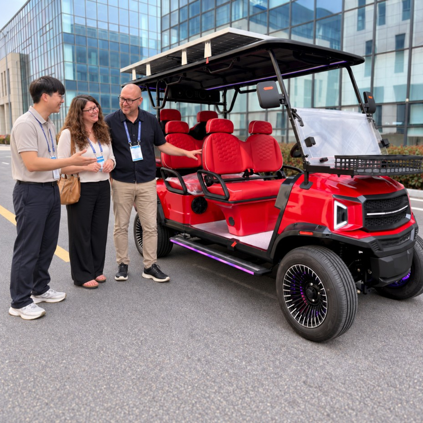 ANT CART team presenting a red six-seat electric golf cart
