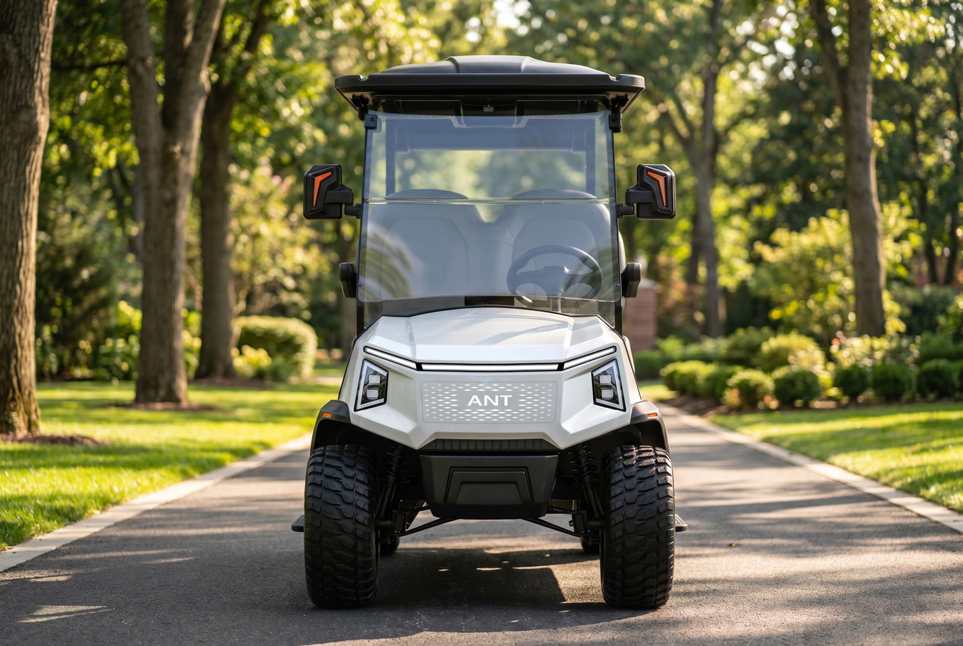 ANT Signature LSV four-seat electric golf cart on a private community road